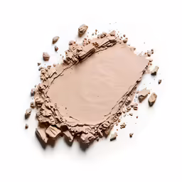 a pink color is lying in a pile of dirt