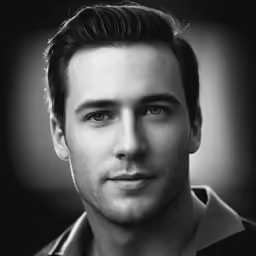 a man is looking at the camera, black and white photo