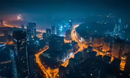 a wide shot of a city at night time