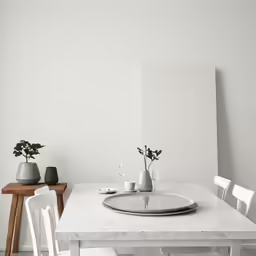 a white table with four chairs around it