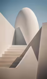 a white building with several steps going up