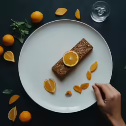 orange slices are garnished with seeds, on a plate