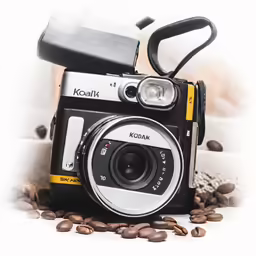 a camera is sitting on some coffee beans