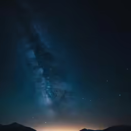 a lake under a very starr filled sky