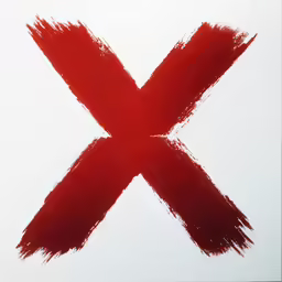 a close up of red painted letters x