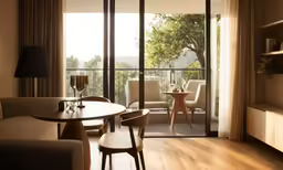 a view of a living room and a balcony