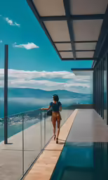woman walking on a walkway over the ocean