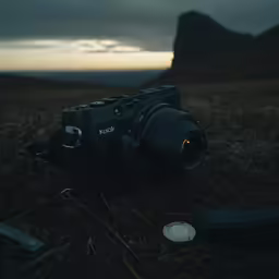 a photograph camera on top of a hill