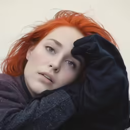 an image of an attractive woman with red hair