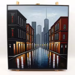 the painting is holding on to a easel with paint,an image of a picture of a city street,the painting is on display for sale,a painting of a city with tall buildings on each side,a painting of a city with the lights on