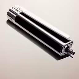 a black and silver type of metal device on a white background