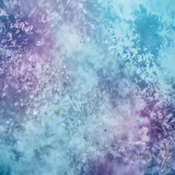 the bubbles of blue, green, purple and white paint cover water