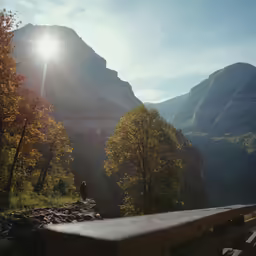 a bench in front of some mountains and water