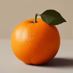 an orange with a leaf on it is sitting on the table