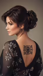 a woman with a back tattoo on her back