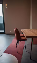 the table and chairs are facing each other