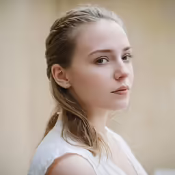 a beautiful young woman looking straight ahead and to the left