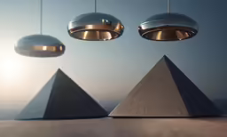 an abstract sculpture depicting three silver lamps and a black one