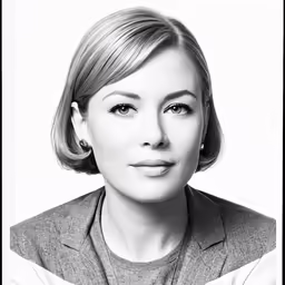 a lady with short hair is posing for the camera