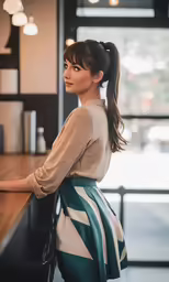 a woman at the counter is looking out into the distance