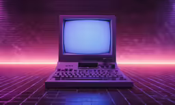 an old - fashioned computer sitting in front of a colorful background