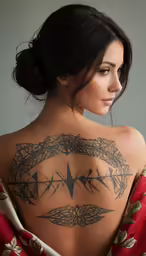 a woman with tattoos in a red dress