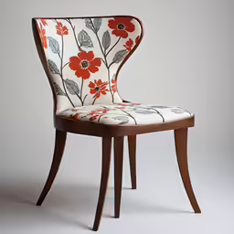 the back of a chair with red flowers on it