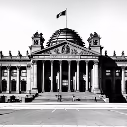 a black and white photo of an architectural building with a flag