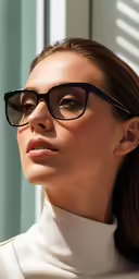 a woman wearing glasses looks into the distance