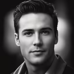 a man posing in a shirt and tie for a black and white photo