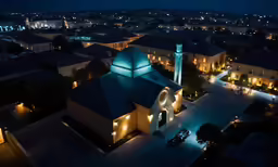 a church with blue lighting on at night time