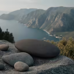 some rocks are laying on top of a cliff
