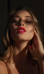 a beautiful young woman posing for the camera