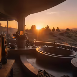 the bathroom is overlooking a vast landscape with lots of greenery
