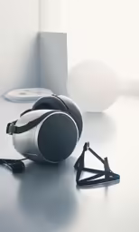 a pair of headphones sitting on top of a white table