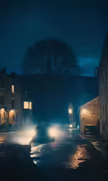 a car passing by a building with its headlights on