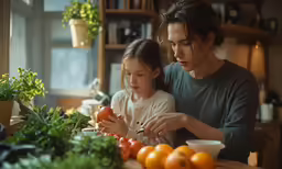 there is a young girl holding a piece of food and being hugged by an older woman