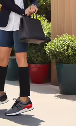 a woman with very short legs carrying a tote bag