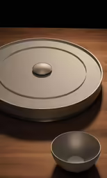 the remote control is positioned on the wooden table