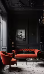 two red couches sit in a dark living room