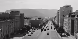 a long highway in a city with buildings
