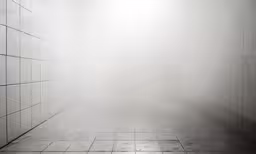 a light is seen in the fog over tiled floors