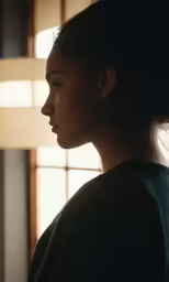 there is a woman that is looking out the window