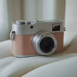 a camera is resting on top of a sheet