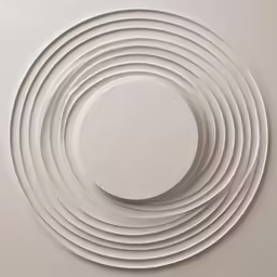 a round white object sitting on top of a wall