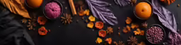 there are oranges, an arrangement of leaves and feathers arranged in bowls