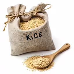 a bag full of rice next to an wooden spoon