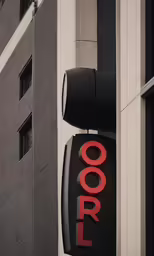 a sign is displayed on a tall building