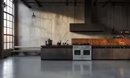 a kitchen area with an oven, counters, and window