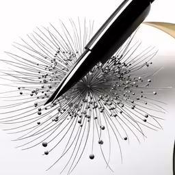 a pen drawing an image with water drops
